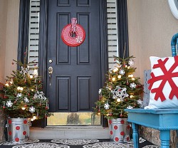 Christmas porch with trees in pails