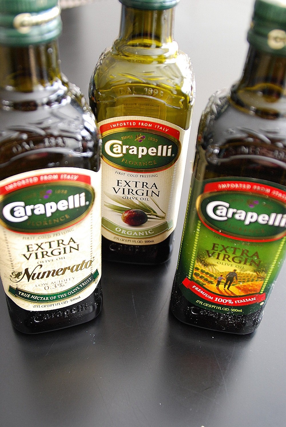 Three Bottles of Carapelli Olive Oil