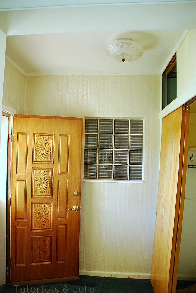 1905 cottage entry before with carpet