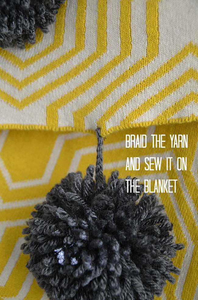 braid the yarn and sew it on the blanket