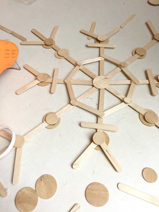 making popsicle stick snowflakes