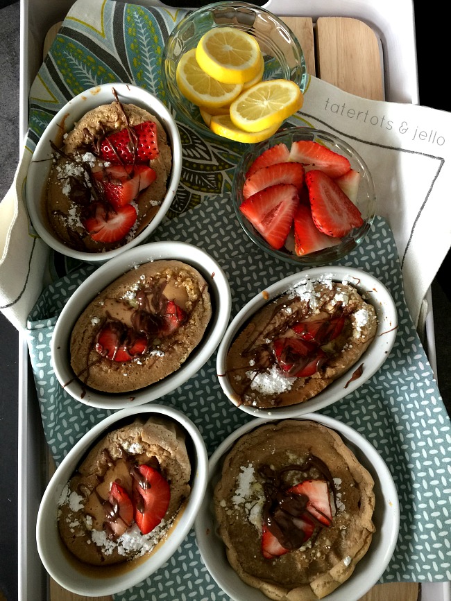 Mini Nutella Dutch Babies German Pancakes. Dutch Babies are a family tradition - light fluffy and these are Nutella! Bake some up for your family! 