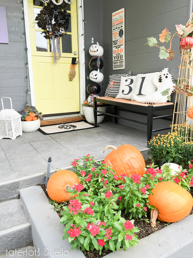halloween porch with stacked pumpkin topiary 