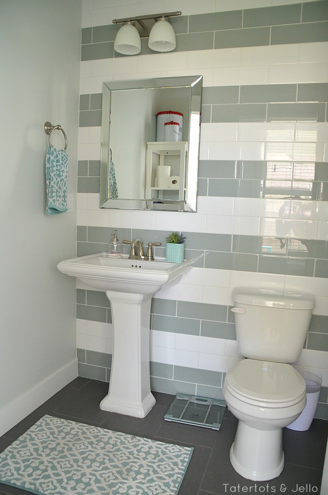green and white striped tile bathroom 