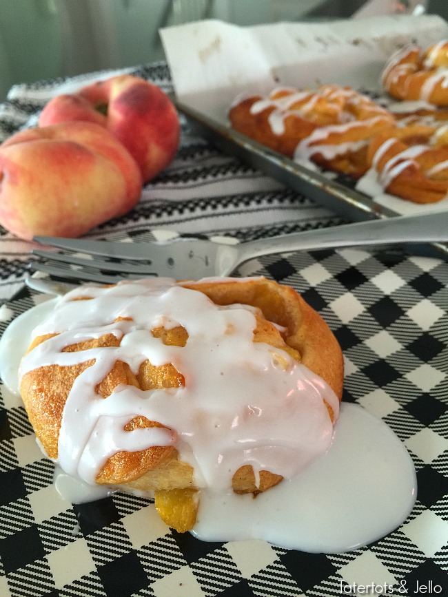 peach cinnamon rolls with glaze