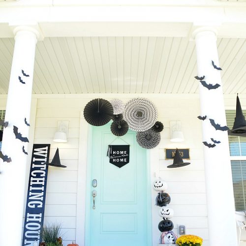 witching hour halloween porch ideas. Create a witch theme for your halloween home decor this year with a DIY sign, hanging hats and other spooky ideas!