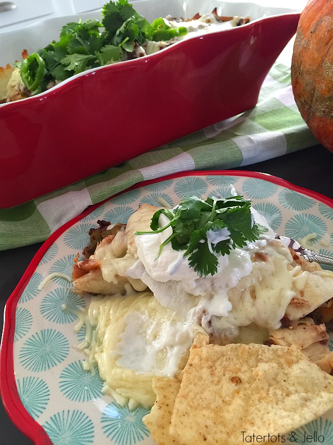 Gooey and delicious pumpkin chicken enchiladas. You will love the combination of carmelized pumpkin and shredded chicken, covered. A perfect fall casserole. Just pop it in the oven for a hearty meal! 