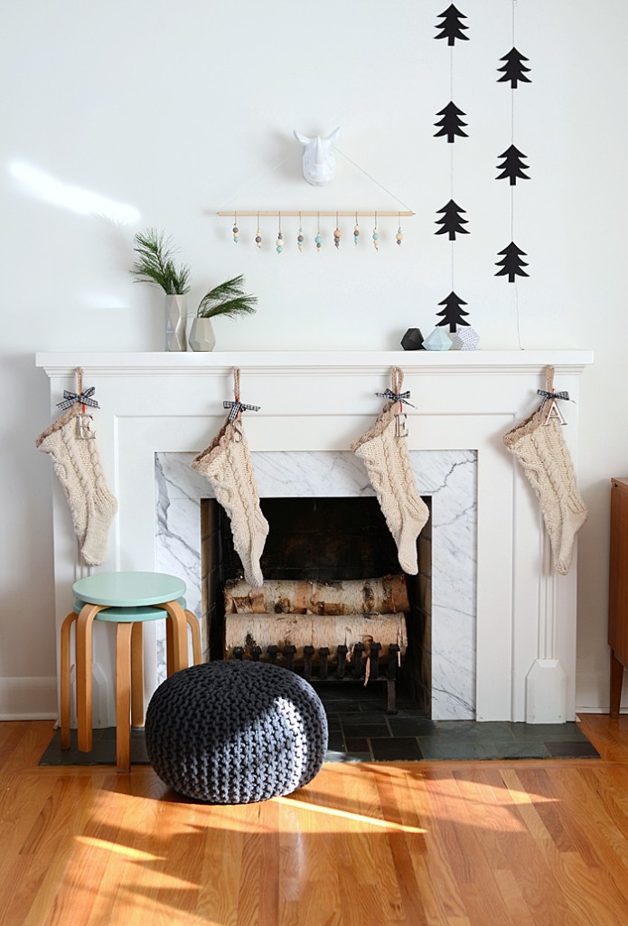Black and White Modern Holiday Mantel. Gorgeous mantel ideas plus over 100 other ways to make the holidays awesome at your house this year! 