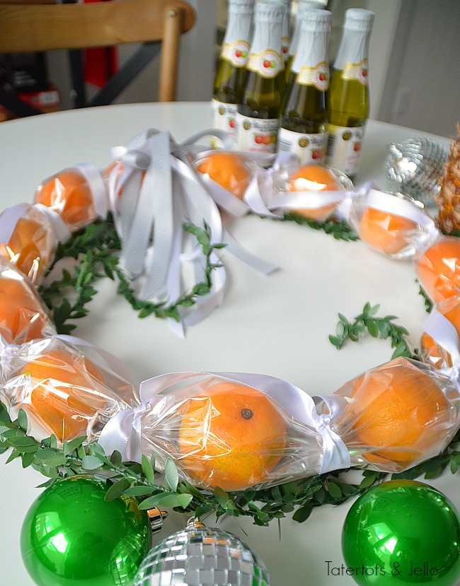 Cuties Wreath Hostess Gift Idea. Use cellophane to create a cuties wreath. It's edible and perfect to give as a neighbor or hostess gift this holiday season! 