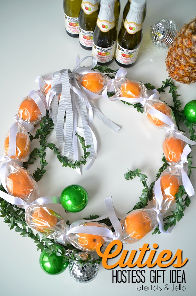 Cuties Wreath Hostess Gift Idea. Use cellophane to create a cuties wreath. It's edible and perfect to give as a neighbor or hostess gift this holiday season! 