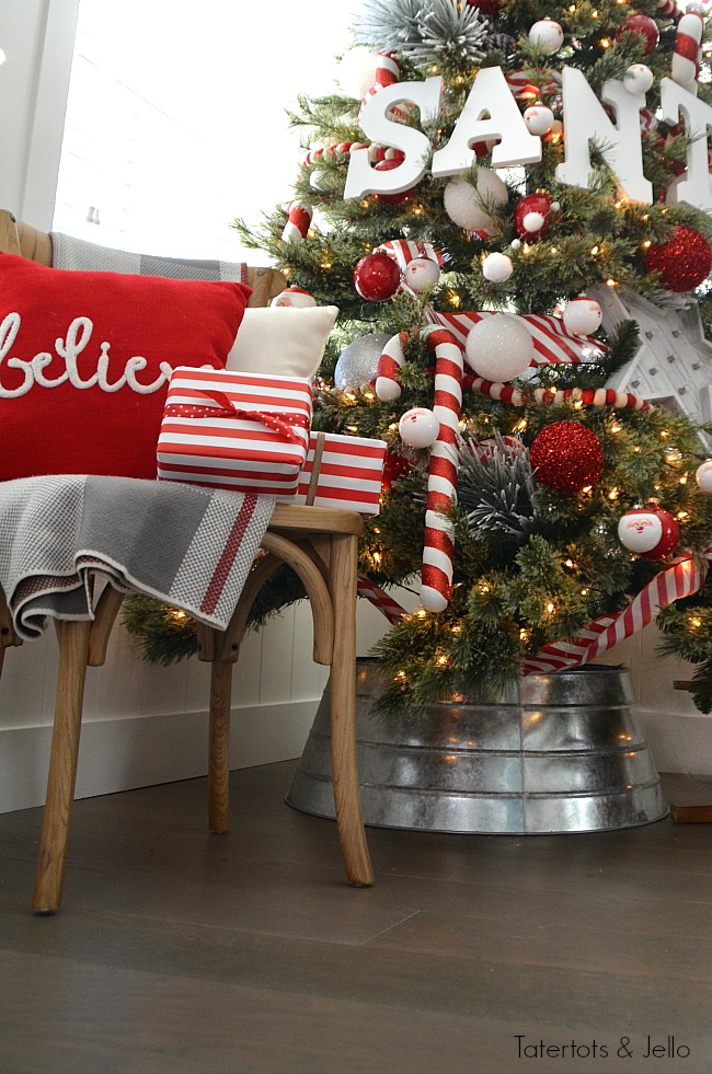 Santa North Pole Christmas Tree decorating ideas. Make a simple red and white Santa christmas tree. Find all the details and DIY ideas at Tatertots and Jello! 