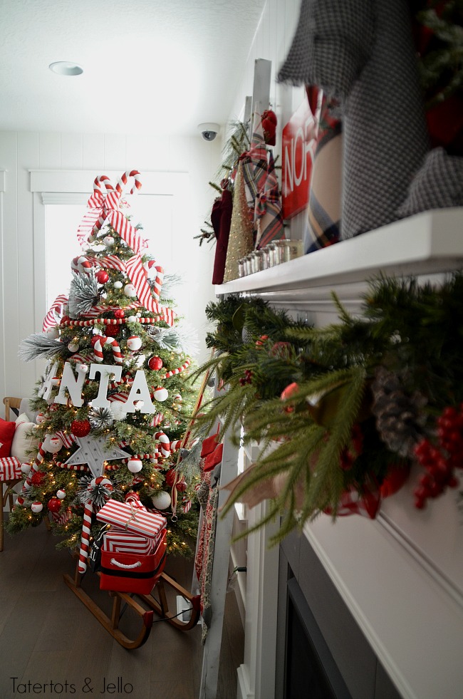 Santa North Pole Christmas Tree decorating ideas. Make a simple red and white Santa christmas tree. Find all the details and DIY ideas at Tatertots and Jello! 