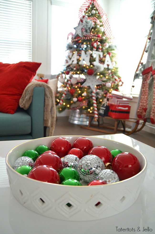 Santa North Pole Christmas Tree decorating ideas. Make a simple red and white Santa christmas tree. Find all the details and DIY ideas at Tatertots and Jello! 