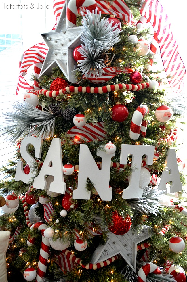 Santa North Pole Christmas Tree decorating ideas. Make a simple red and white Santa christmas tree. Find all the details and DIY ideas at Tatertots and Jello! 