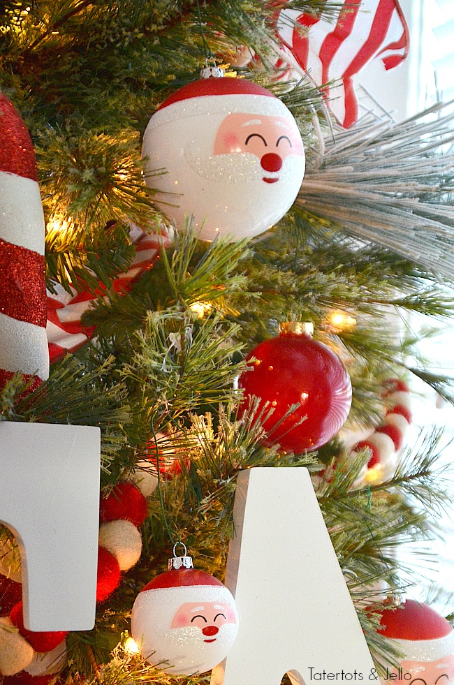 Santa North Pole Christmas Tree decorating ideas. Make a simple red and white Santa christmas tree. Find all the details and DIY ideas at Tatertots and Jello! 