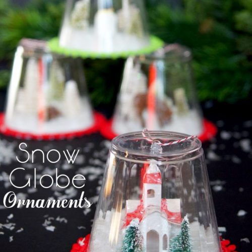 DIY Snow Globe Ornament Craft. Make these little snow globe ornaments to hang on your tree or as a little village to display in your home!
