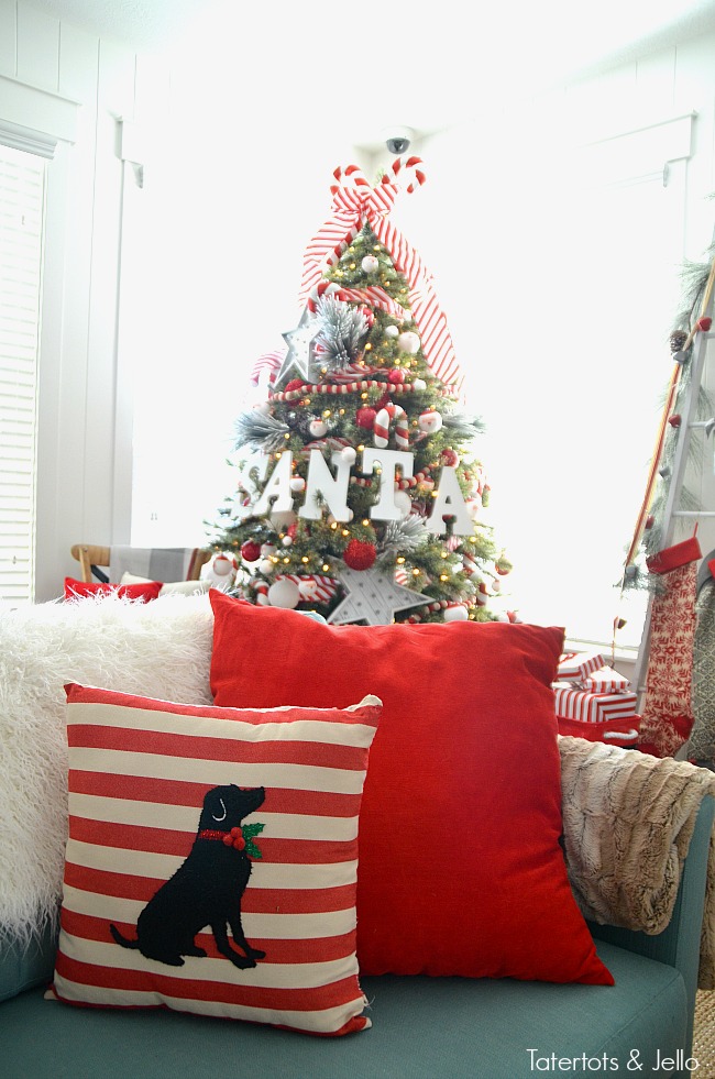 Santa North Pole Christmas Tree decorating ideas. Make a simple red and white Santa christmas tree. Find all the details and DIY ideas at Tatertots and Jello! 