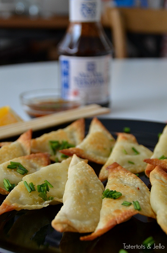 Baked Asian Pierogies with Orange Teriyaki Dipping Sauce. Take traditional pierogies and give them an asian twist with these easy asian appetizers. Perfect for the holidays!