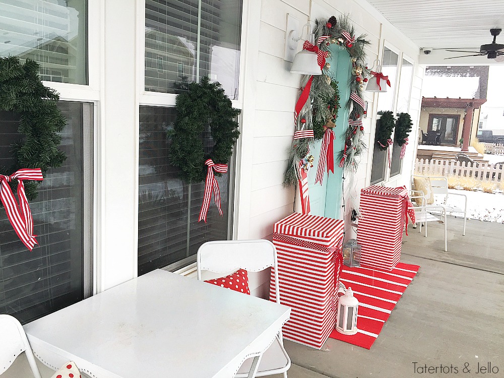 Red and White North Pole Christmas Porch. Many different inexpensive ways to celebrate the season and decorate YOUR outdoor space!