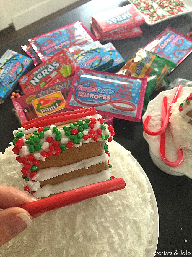 Mini Gingerbread Village Cakes. Add mini gingerbread cakes to the top of cakes for a fun centerpiece for holidays parties. Gingerbread decorating ideas! 