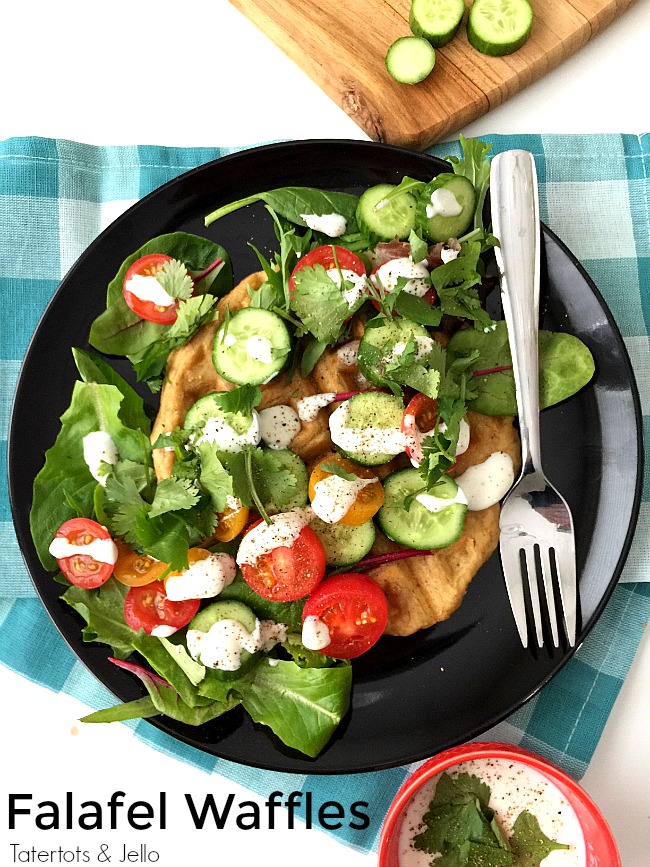 Savory Falafel Waffles are a savory dinner idea. Warm and savory waffles that taste like falafels are surrounded by a cool salad and tangy yogurt dressing. 