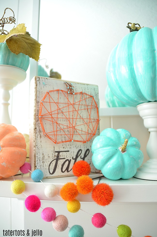 Colorful Fall Mantel with Painted Foam Pumpkins. Paint inexpensive pumpkins bright colors for a unexpected colorful fall mantel!