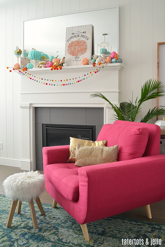 Colorful Fall Mantel with Painted Foam Pumpkins. Paint inexpensive pumpkins bright colors for a unexpected colorful fall mantel!