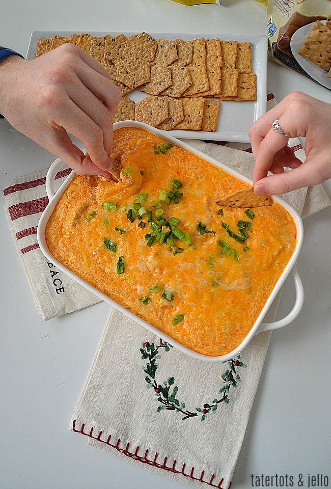 Instant Pot Buffalo Chicken Dip is perfect for the holidays! It only take minutes to make and the spicy flavor contrasts perfectly with Crunchmaster Crackers.