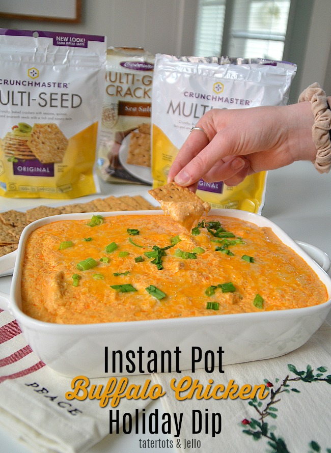 Instant Pot Buffalo Chicken Dip is perfect for the holidays! It only take minutes to make and the spicy flavor contrasts perfectly with Crunchmaster Crackers. 