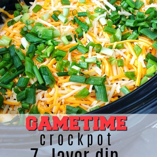 Game Day Warm Crock-pot 7-layer dip - all of the delicious layers blend together in your Crock-pot to create the PERFECT hot dip to serve!