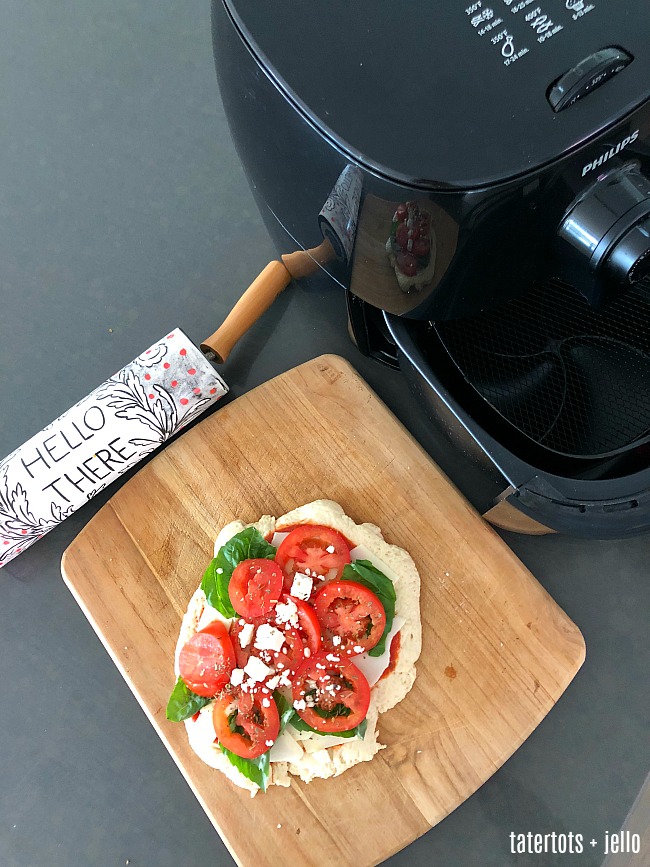 Airfry Pizza Party - kids will love making personalized pizzas. Have everyone make theirs and then cook them in the airfryer. It only takes a few minutes for a perfectly crispy pizza! 