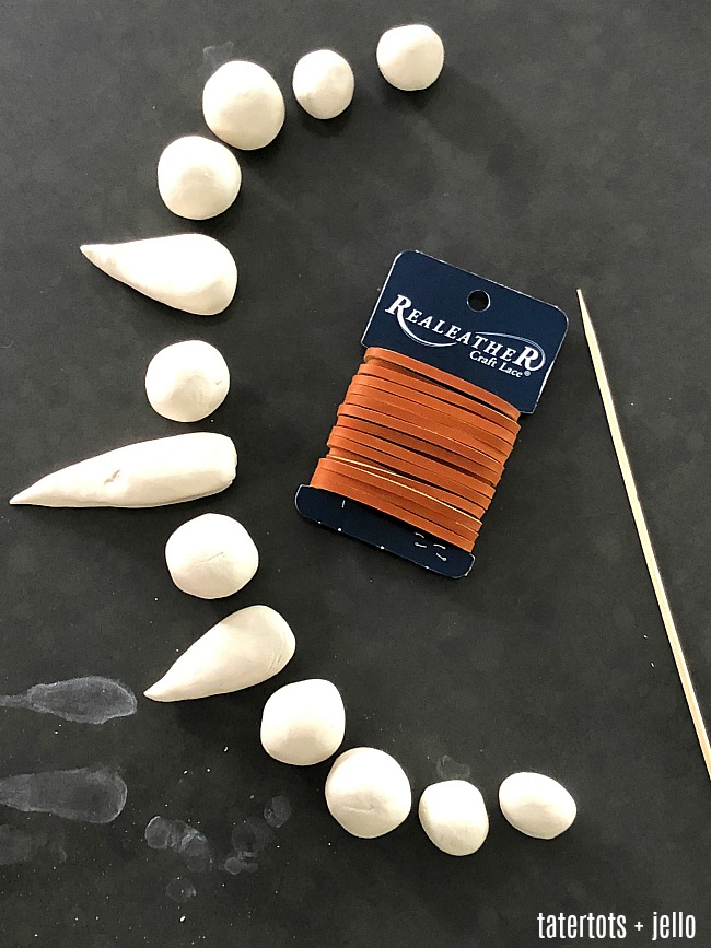 Kids Clay Caveman Necklace - make clay necklaces with your kids. They will love creating whimsical necklaces out of clay!