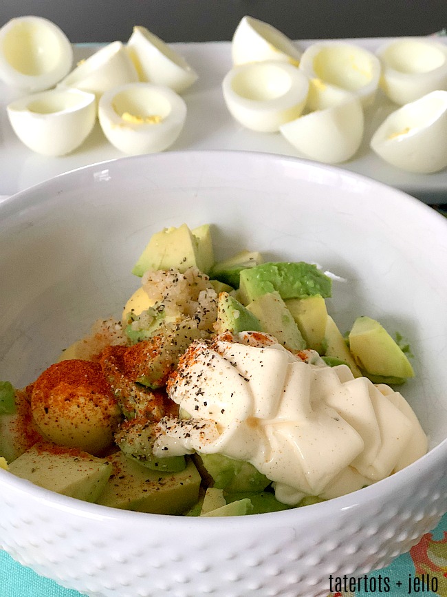 Spicy Avocado Deviled Eggs are a zesty twist on traditional deviled eggs. Filled with creamy avocado and egg yolks, plus spiced and topped with sliced jalapenos, these eggs will be the star of your spring brunch! 