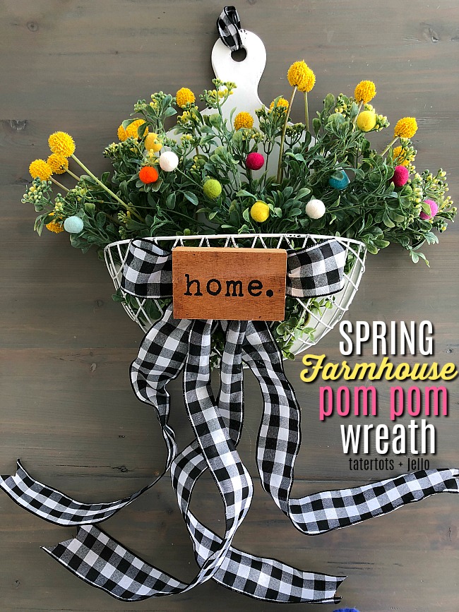 Spring Farmhouse Pom Pom Wreath - turn a wood organizer into a whimsical farmhouse wreath for your door! 