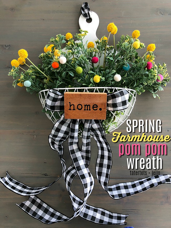 Spring Farmhouse Pom Pom Wreath - turn a wood organizer into a whimsical farmhouse wreath for your door!