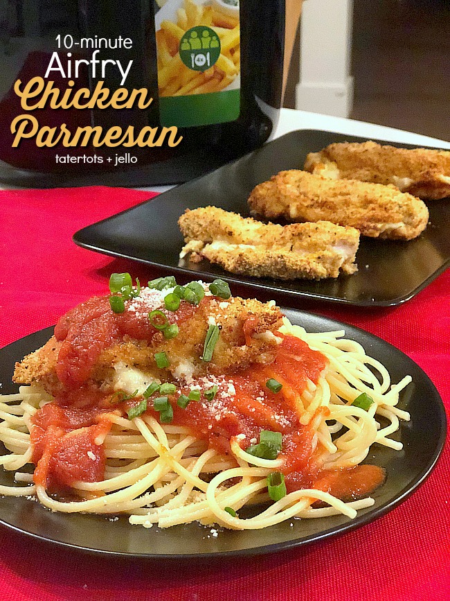 10-minute Chicken Parmesan using the Airfry machine. Much healthier than traditionally fried chicken parmesan. Crispy on the outside, moist on the inside with gooey cheese and a topping of tomato sauce. Yum!