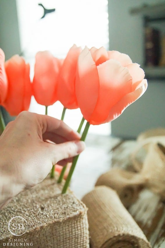 18 DIY Spring Home Ideas!  to make a DIY Spring tulip centerpiece pink flowers and a burlap vase.