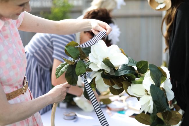 Make a DIY Magnolia Garden Wreath for Summer. All it takes is a few materials and in less than 15 minutes you will have a beautiful wreath to hang on your door or wall! 