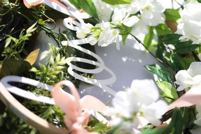 Make a DIY Magnolia Garden Wreath for Summer. All it takes is a few materials and in less than 15 minutes you will have a beautiful wreath to hang on your door or wall! 