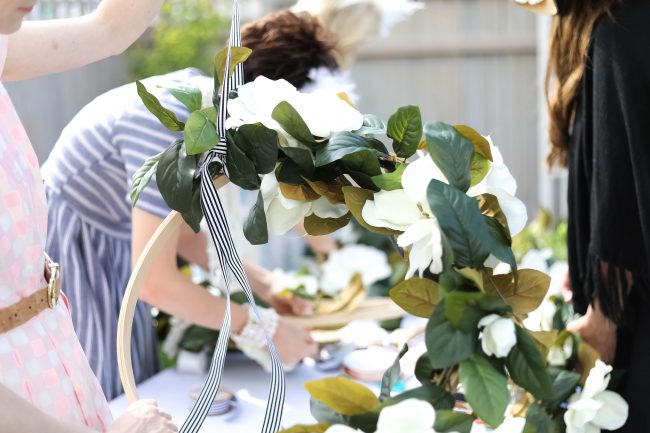 Make a DIY Magnolia Garden Wreath for Summer. All it takes is a few materials and in less than 15 minutes you will have a beautiful wreath to hang on your door or wall! 