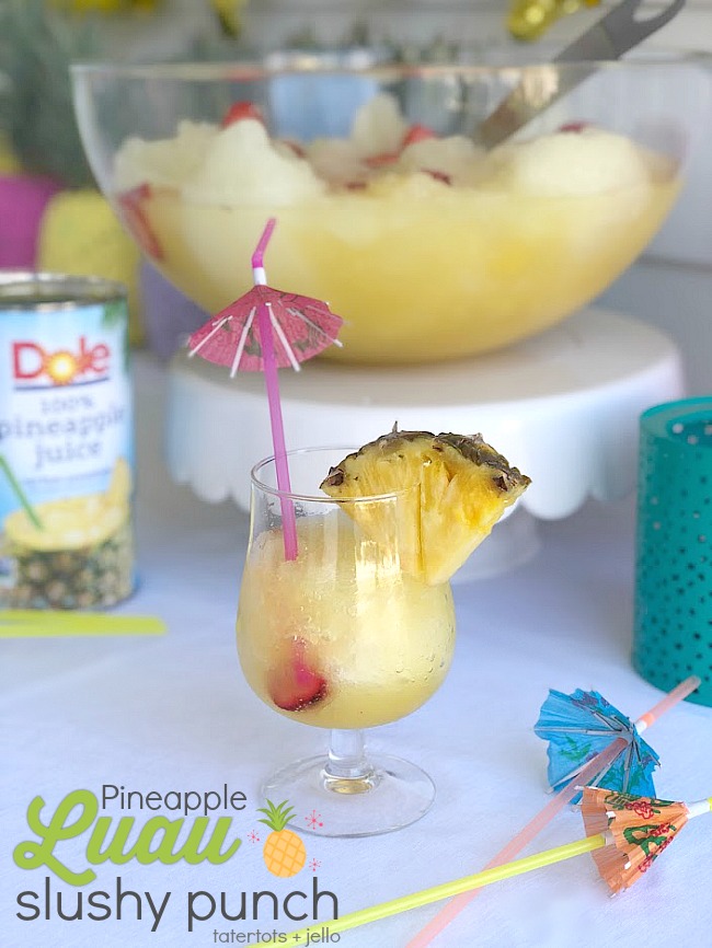 Pineapple Lime Luau Slushy Punch is a party must! Refreshing pineapple and tangy lime combine favors in this fizzy, fruity, slushy punch that makes enough for a crowd!