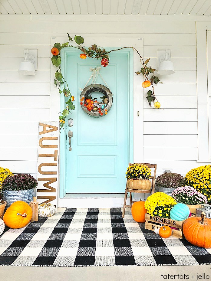 My plaid fall porch - use plaid and bright colors welcome fall! Welcome guests to your home with these easy and inexpensive Autumn DIY ideas! 