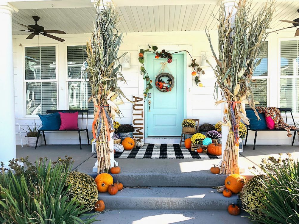 My plaid fall porch - use plaid and bright colors welcome fall! Welcome guests to your home with these easy and inexpensive Autumn DIY ideas! 