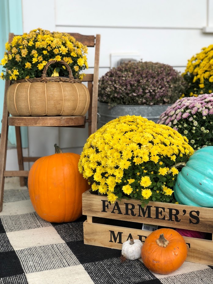My plaid fall porch - use plaid and bright colors welcome fall! Welcome guests to your home with these easy and inexpensive Autumn DIY ideas! 