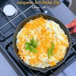 Tailgating Jalapeno Artichoke Dip recipe. Make it in the oven OR take it tailgating and cook it on your camp-stove. Creamy and full of flavor with a spicy kick, this dip will be the hit of the party! 