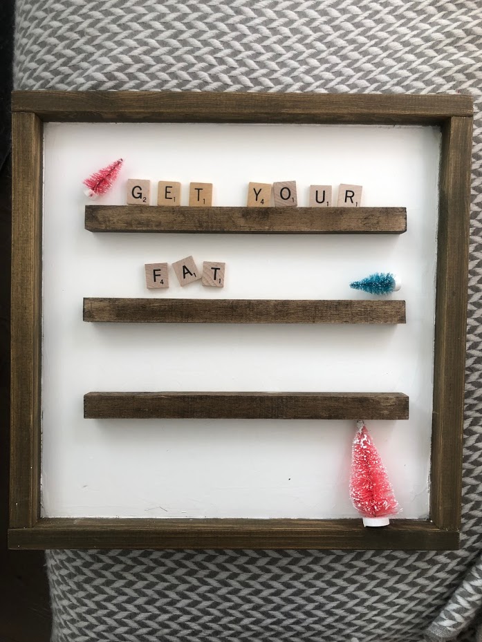 How to Make a DIY Holiday Scrabble Tile Letter Board. Take an old frame, add paint, wood molding and scrabble letters for a DIY letter board you can use all year! 