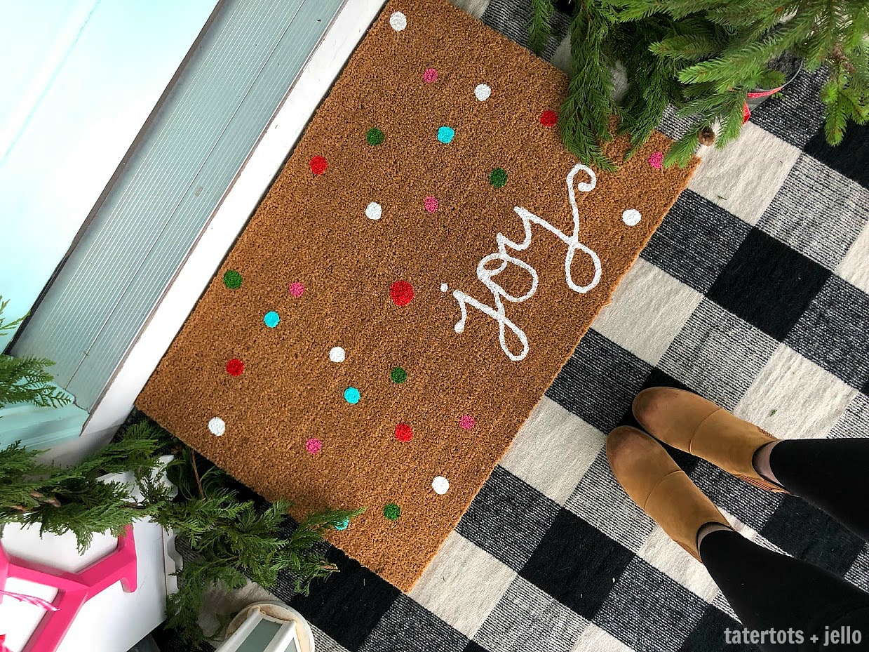 Joy to the World Holiday Porch. Bright colors, a GIANT Joy sign, Snowball Wreath and hand-painted rug create a happy welcome for family and friends with holiday season! 