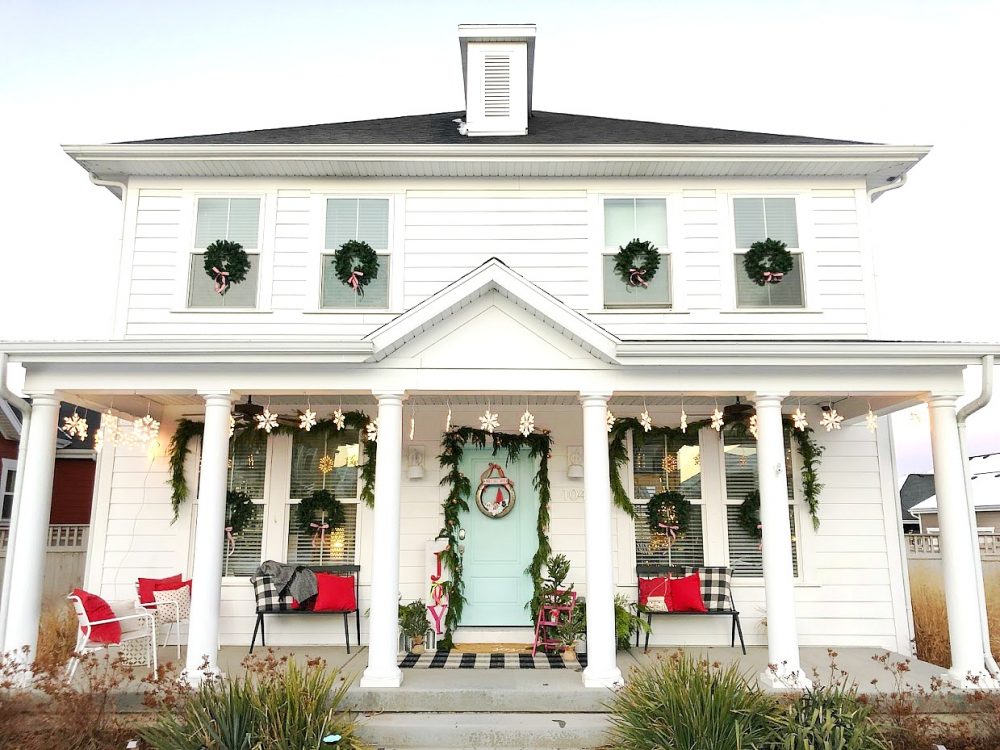 Joy to the World Holiday Porch. Bright colors, a GIANT Joy sign, Snowball Wreath and hand-painted rug create a happy welcome for family and friends with holiday season! 