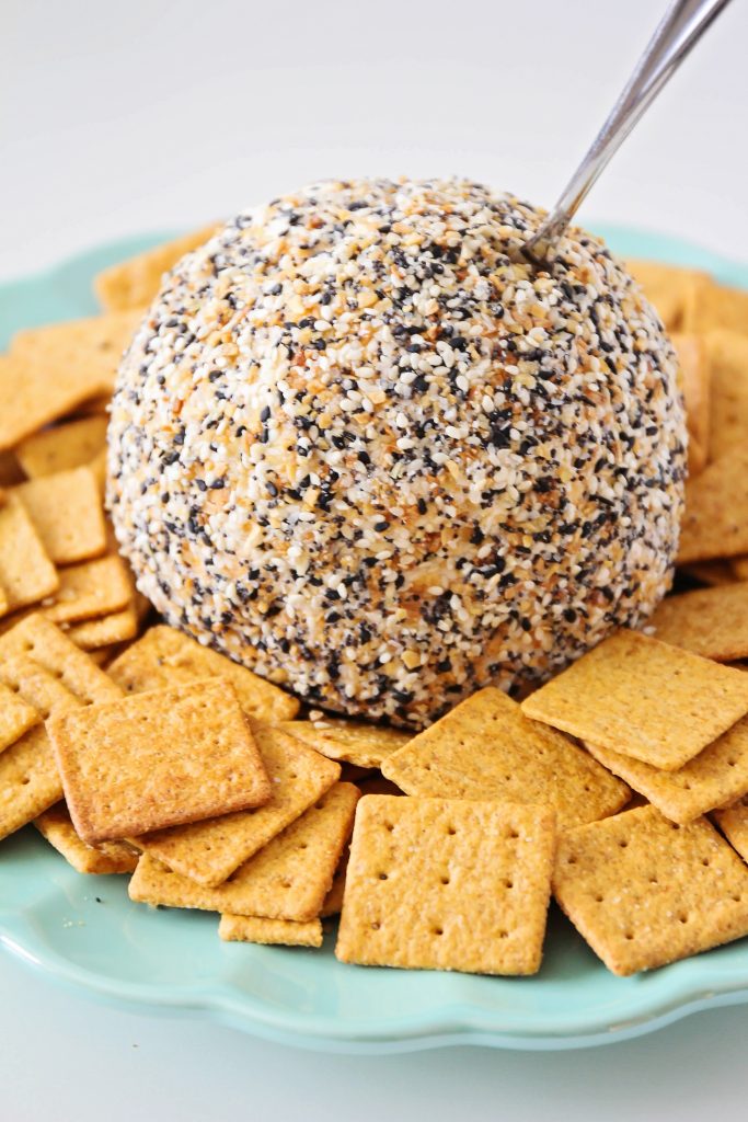 Everything Bagel Seasoning Cheeseball Recipe - perfect for the holidays! Soft and flavorful on the inside and crunchy and nutty on the outside. We took grand,ma's classic cheeseball recipe and added a crunchy and zesty twist! 