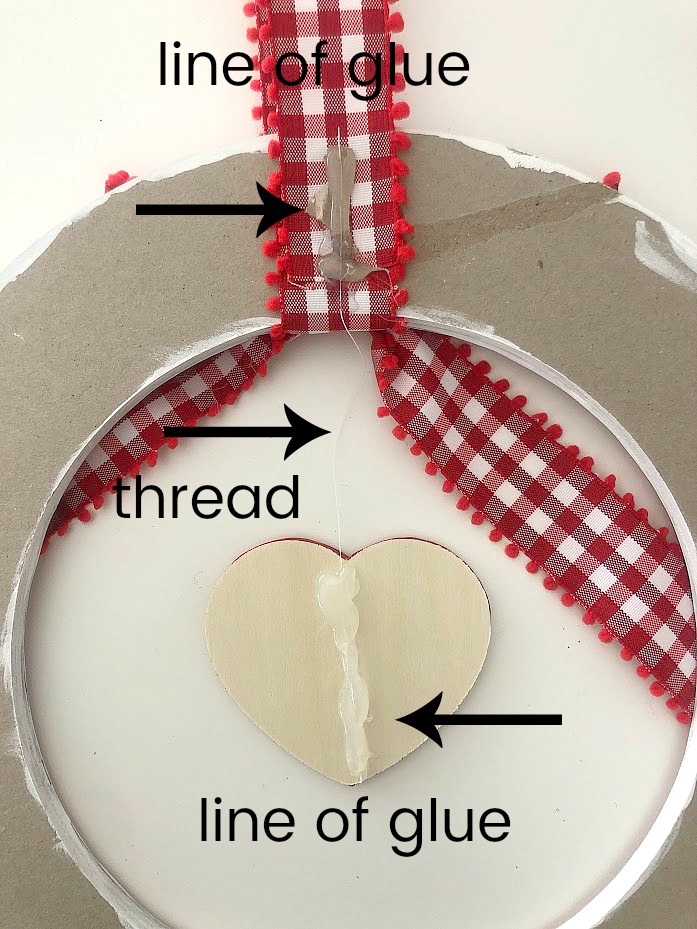 Valentine's Day Floating Conversation Heart Wreath. Turn your favorite paper into a cute wreath for Valentine's Day and add a floating heart with a Valentine's Day saying!